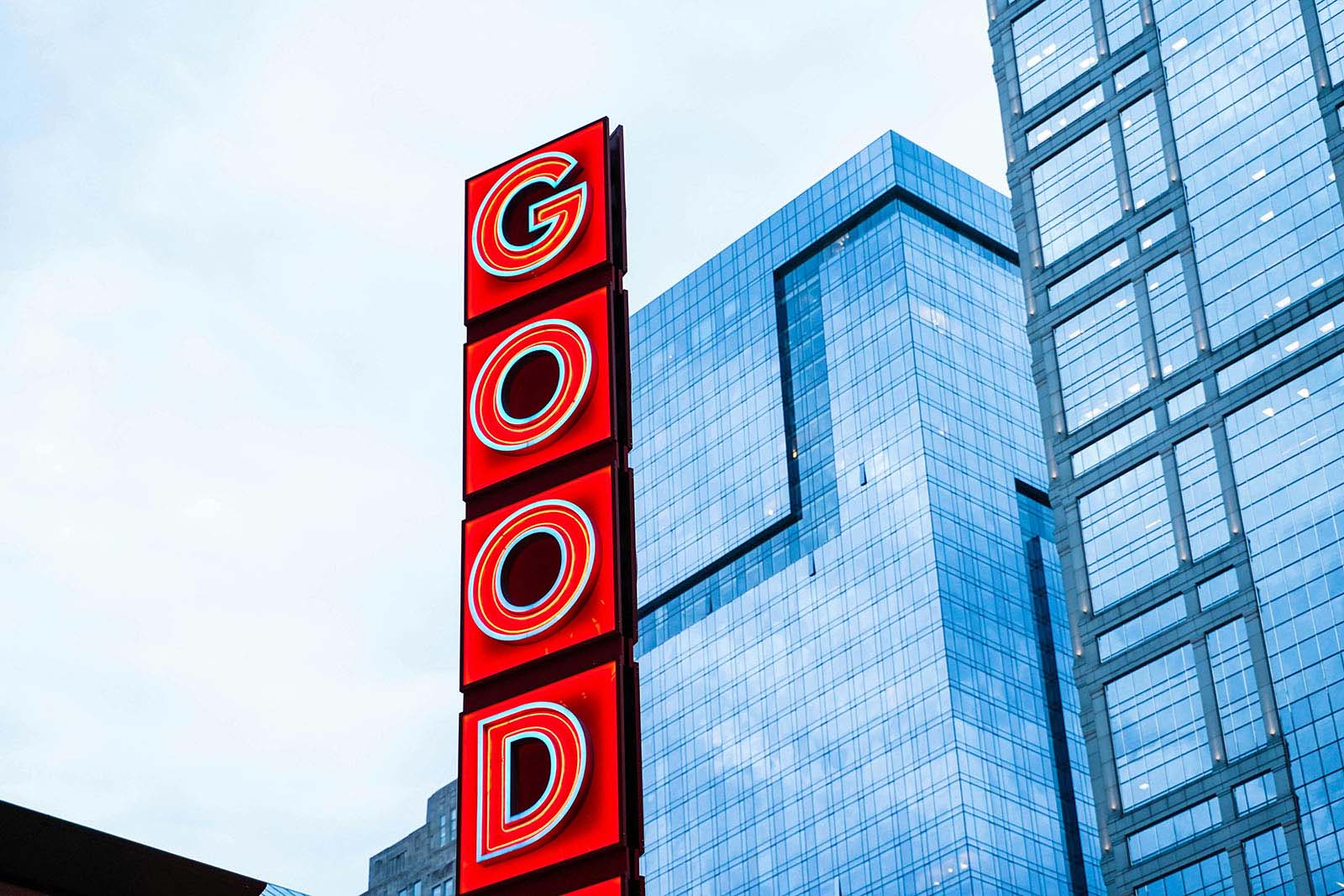 GOOD sign on city building